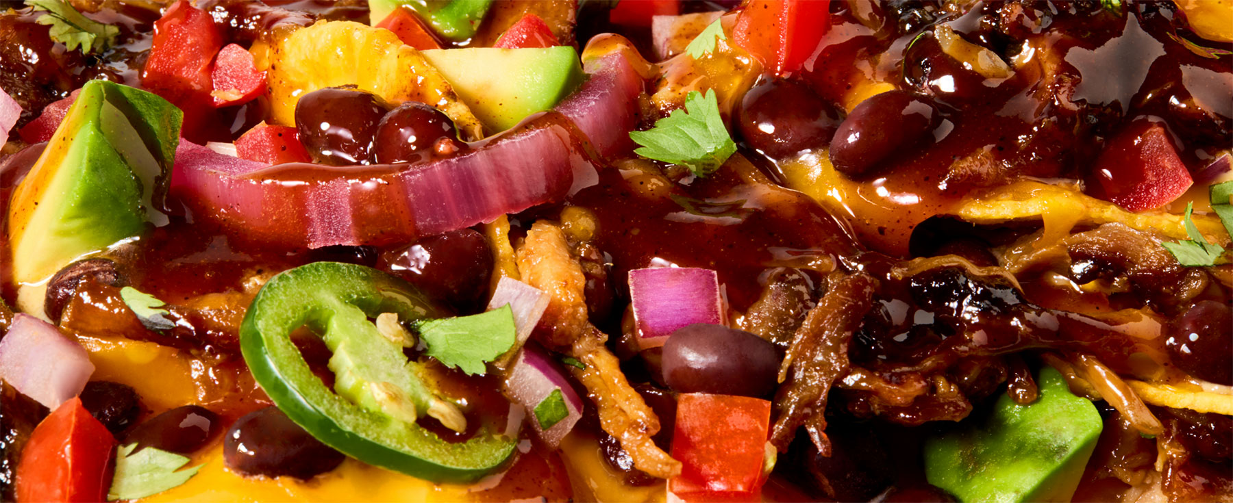 Close up photo of nachos with beans.